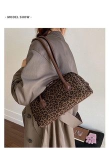Detail view of large leopard print baguette shoulder bag for women office commuting