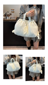 Detail of cream-colored puffy cloud tote bag featuring quilted nylon and drawstring pleats