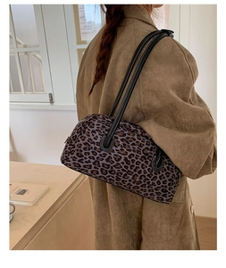 Leopard print baguette bag shoulder bag shown on model for daily style and size scale