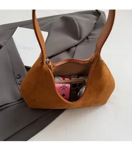 Internal view showing large capacity of the brown suede tote bag with daily essentials