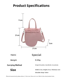 Pink plush glove-shaped handbag dimensions showing width 21cm and height 21cm on white backdrop