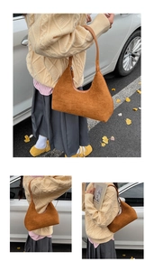 Detail view of caramel brown suede hobo bag with vintage crescent silhouette and fine strap