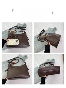 Detail view of coffee brown shoulder bag featuring leather knot decor and dog charm