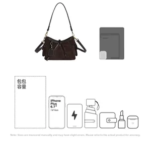 Detailed interior capacity showing daily essentials in a coffee suede crossbody bag