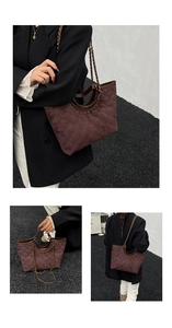 Detail view of coffee suede quilted tote bag with chain strap and embroidered rhombic pattern