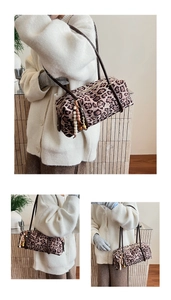 Detailed view of leopard print cylinder crossbody bag with wooden bead fringe tassel