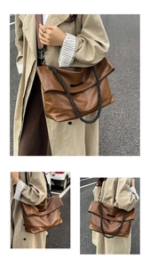 Close-up of vintage brown leather tote bag with unique black braided rope handle design