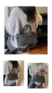 Detail of black quilted tote bag showing matte leather texture and diamond stitching
