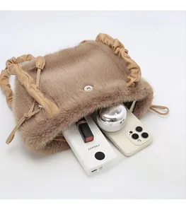 Internal view of brown faux fur tote bag showing spacious capacity and magnetic buckle