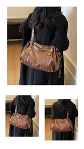 Detail of a brown retro PU leather hobo bag with side drawstring and metal buckle accents