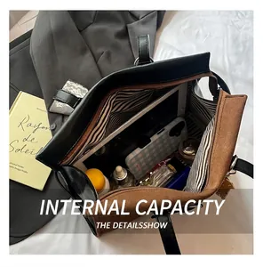 Interior view of large tote bag showing high capacity for tablets and cosmetics