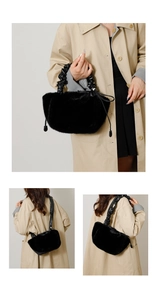 Detail of black faux fur handbag featuring pleated leather handle and drawstring charms