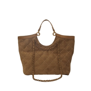 Brown quilted tote bag with chain strap and matte finish for women on white background
