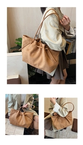 Macro detail of brown suede tote bag featuring knot drawstring and premium texture