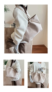 Detail showing soft suede texture and drawstring knot on beige minimalist tote bag
