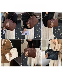 Detail view of quilted tote bags in brown, beige and black with cute bear charms