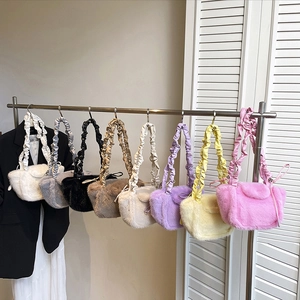 Plush faux fur crossbody bag with scrunchie handle in eight vibrant colors for winter