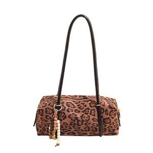 Leopard print cylinder shoulder bag with bead charms and black leather straps