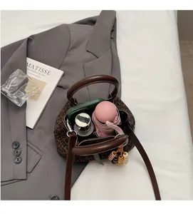 Top-down view of a leopard print bucket bag interior showing large storage capacity