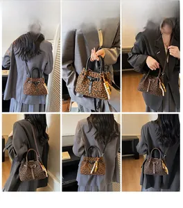 Detailed model showcase of leopard print bucket bag in crossbody and handheld styles