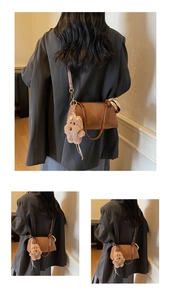 Close-up of brown suede crossbody bag featuring a cute plush puppy charm detail