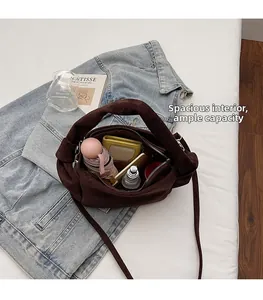 Macro view of spacious dark brown bag interior showing large capacity for daily essentials