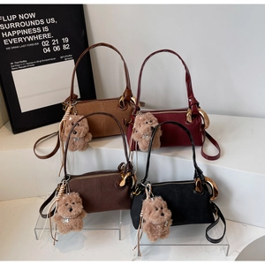 Chic cylinder shoulder bags in four retro colors with cute plush dog charms