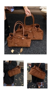 Detail view of brown suede tote bag in two sizes with leather handles and metal buckles