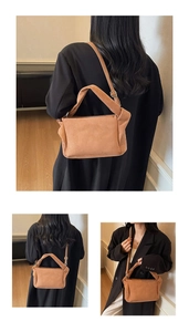 Detail view of caramel brown pleated shoulder bag with unique knotted handle and suede texture