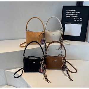 Suede bucket bags in four colors with leopard bear charms and silk ribbons