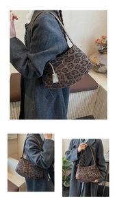 Detail of vintage leopard print crescent hobo bag with slim brown shoulder strap
