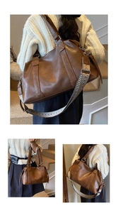 Detail of large tote bag in dark brown faux leather featuring an ethnic embroidery strap