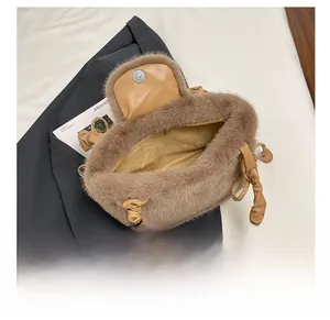 Detail of plush faux fur tote bag showing spacious interior and secure metal zipper