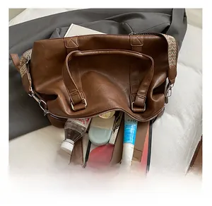 Detailed interior of a large brown tote bag showing its spacious capacity for daily essentials