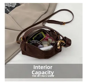 Interior view of brown leather bag showing spacious capacity for daily essentials