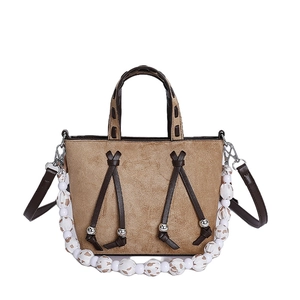 Retro khaki tote bag with leopard print bead chain and brown leather handles on white background