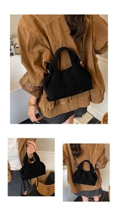 Detail shots of the black cloud bag showing hand-carry and crossbody styling options