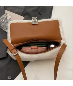 Internal view of faux fur leather bag showing spacious capacity for phone and wallet