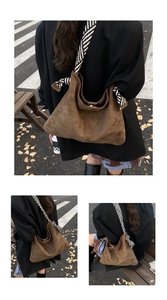 Detail view of the brown suede tote bag with a striped woven wide shoulder strap