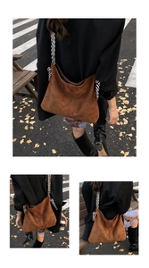 Close-up of brown suede tote bag featuring a striped woven strap and large capacity