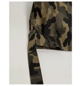 Detail of durable camo fabric shoulder strap with reinforced stitching and twill texture