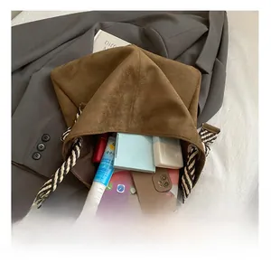 Top view of coffee suede bucket bag showing large capacity for gadgets and daily items