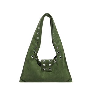 Dark green suede shoulder bag with metallic eyelets and stud accents on a white background