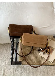 Retro suede crossbody bags in brown and khaki with wooden bead tassel details