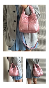 Detail of pink metallic quilted handbag with soft puffer texture and shoulder strap