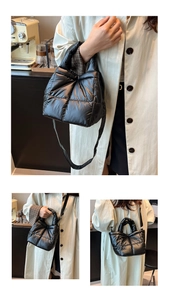 Detail of black quilted puffer handbag featuring glossy nylon fabric and crossbody strap