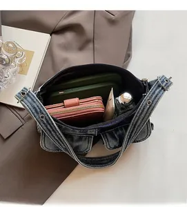 Internal view of retro denim shoulder bag showing space for phone and wallet