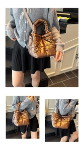 Detail view of metallic quilted crossbody bag with glossy checkered texture and shoulder strap