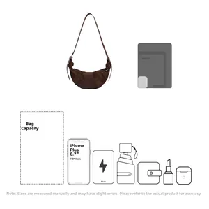 Detail view of large capacity dark brown crossbody bag showing spacious interior storage