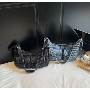 Detailed view of Y2K denim bags featuring cargo pockets and metal eyelet straps